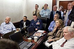 Obama and Biden, along with members of the national security team watching a live feed