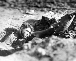 Dead gunner in a German machine gun nest, Villers-devant-Dun, France, November 4, 1918.