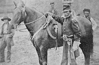 Colonel Gibson with horse later shot from under him