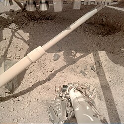 The thrusters of the InSight lander dug pits during landing beneath it at its landing site.