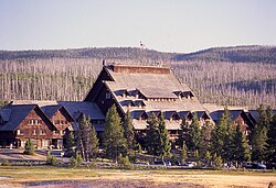 Old Faithful Inn, constructed 1904, serves Yellowstone. It is perhaps the largest log building in the world
