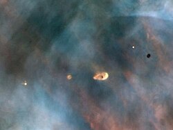 Hubble image of protoplanetary discs in the Orion Nebula, a stellar nursery approximately 25 ly across and estimated to be similar to the primordial nebula from which the Sun formed