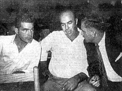 Bryant (left) and Milam (center) conferring with their attorney