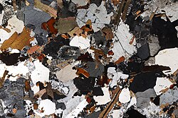 Granite in thin section, under cross-polarized light
