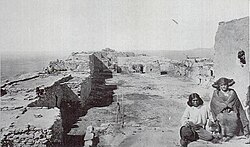 Nampeyo and her brother Tom Polacca on the rooftop of the Corn clan dwelling at the Hano village, photograph taken in 1875 by William Henry Jackson (Colorado Historical Society)[8]