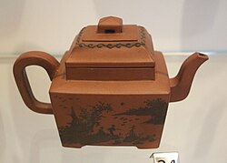 Chinese Yixing teapot, Qing dynasty, c. 1765–1835, with painted slip.