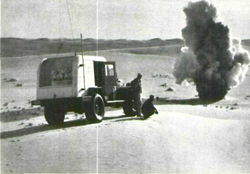 Seismic reflection survey being conducted in Saudi Arabia, c. 1960. A controlled explosion generates seismic waves that are detected by geophones.