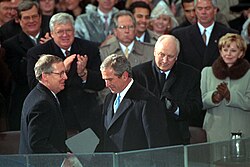 President George W. Bush shakes hands with McConnell at the former's first inauguration in January 2001.