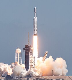 A Falcon Heavy rocket launches Europa Clipper into a trajectory to Jupiter; mission demands required all parts of the partially reusable launch vehicle to be expended.