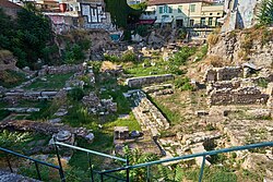 The excavated area of the northwest corner of the Agora, from the south. At right, the Stoa Poikile; in the lower foreground, the Hellenistic gate; at left, the Temple of Aphrodite Urania.