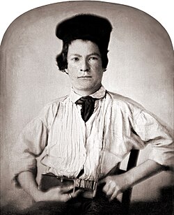 Samuel Clemens, age 15 holding metal type in a composing stick that spells out his first name. As a daguerreotype, whose creation involved no intermediate negative, the image is laterally reversed. Hence the type, which, in actuality, was backward, is readable, though Twain himself is flipped.