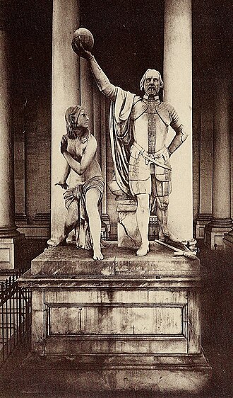 The Discovery of America (1844) sculpture, depicting a triumphant Columbus and a "female savage" (Native woman), which stood outside the U.S. Capitol