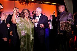 2012 Aretha Franklin is joined onstage by Academy Awards Council member General Colin Powell during her performance to close the evening of the 50th annual Banquet of the Golden Plate ceremonies in Washington, D.C.