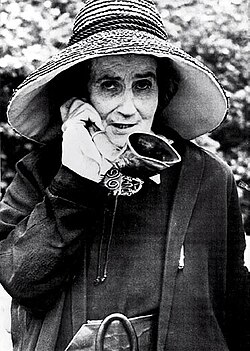Madame de Meuron, a Swiss eccentric with her characteristic ear trumpet and hat.