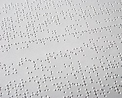 Braille is a system of raised dots representing letters, numbers, punctuation, and words.