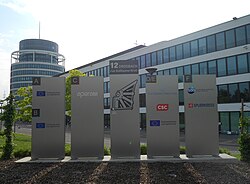 Signs in front of the Centre Drosbach near the Cloche d'Or, in the city of Luxembourg