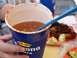 Michelada with lime, salt and chili pepper.