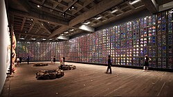 Held at the Museum of Old and New Art in Hobart, Tasmania, Sidney Nolan's Snake mural (1970) is inspired by the Aboriginal creation myth of the Rainbow Serpent, as well as desert flowers in bloom after a drought.[379]