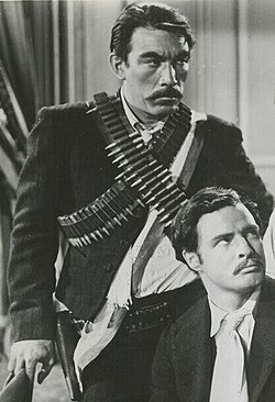 As Eufemio Zapata (standing), with Marlon Brando as Emiliano Zapata in Viva Zapata! (1952)