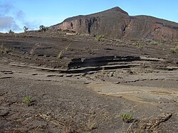 Tephra layers near the caldera (left) and summit (background) of Mount Tambora
