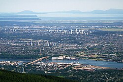 Many Canadian cities feature numerous pockets of high density throughout even their most distant suburbs. As a result, some Canadian suburbs have skylines that eclipse the downtowns of many American cities. Pictured are the skylines of Burnaby, British Columbia, a suburb of Vancouver.