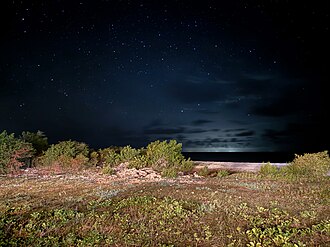 Antiguan city lights seen from the South Coast of Barbuda. Light pollution is a major problem in the country.[42]