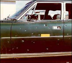 William's car riddled with bullets.