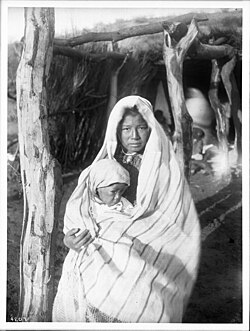 A Yaqui mother holding a baby, Arizona, c. 1910