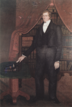 1845 portrait displayed in the Nauvoo Temple celestial room. Young titled the painting, Delivering the Law of the Lord. On the table are a Book of Mormon and Bible, and a third book titled, "Law of the Lord,"