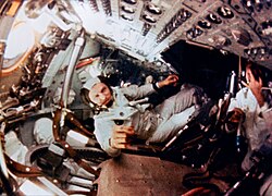 Still from film of the crew taken while they were in orbit around the Moon. Frank Borman is in the center.