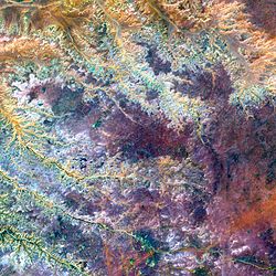 A VNIR image of the Ghadamis River in Libya. This is a false-color composite image made using near-infrared, green, and blue wavelengths.