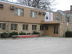 This medical clinic building in the East Grove Street District in Bloomington, Illinois is an example of a non-contributing property.