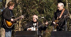 Scruggs performing with his sons Randy and Gary at Hardly Strictly Bluegrass, 2009