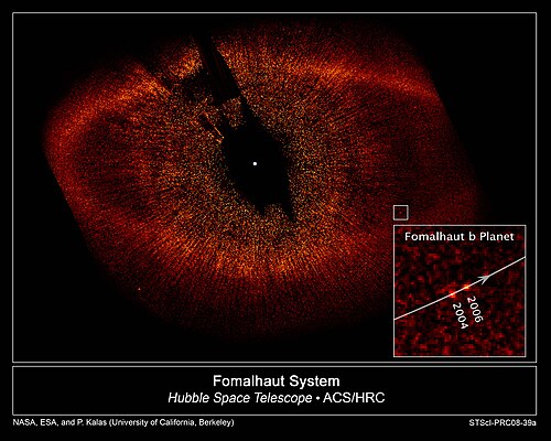 Hubble views the Fomalhaut system. This false-color image was taken in October 2004 and July 2006 with the Advanced Camera for Surveys.