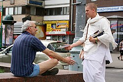 A member of the International Society for Krishna Consciousness proselytising on the streets of Moscow, Russia