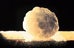 A large hailstone, about 6 cm (2.4 in) in diameter