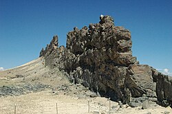 A dike of lamprophyre near the Shiprock volcanic plug, New Mexico, that has resisted the erosion that removed some of the softer rock into which the dike was originally intruded