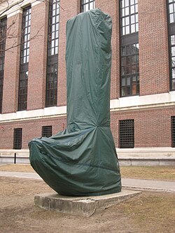 Since 1998, Harvard University wraps some of the bronze and marble statues on its campus, such as this "Chinese stele", with waterproof covers every winter, in order to protect them from corrosion caused by acid rain and acid snow.[33]
