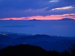 Sunset at the Aeolian Islands seen from mount Dinnammare, in the Peloritani range.