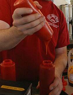 Transferring ketchup between plastic bottles