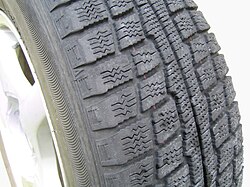 A winter tire without studs, showing tread pattern designed to compact snow in the gaps.[26]