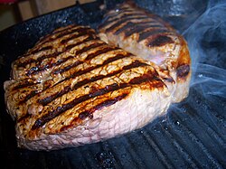 Beef rump steak on grill pan, cooked medium rare