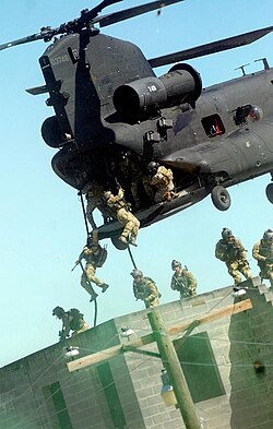 U.S. Army Rangers practicing fast roping techniques from an MH-47 during an exercise at Fort Bragg