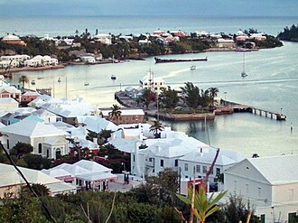St. George's town (originally named New London), in the Islands of Bermuda, or "The Somers Isles". The colony was founded by the wrecking of the flagship of the Virginia Company in 1609. The company's charter was extended to include Bermuda in 1612, and it has remained an English (since 1707, British) colony ever since. Since the rebellion of Virginia, it has been the oldest-remaining British colony, and the town of St. George's is the oldest continuously inhabited British settlement in the New World.[46]