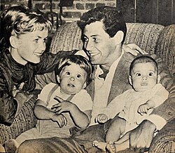 Fisher with her parents and brother in a photo taken for an issue of Modern Screen, 1958