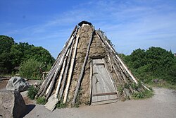 Reconstruction of a peat goahti at Skansen open-air museum