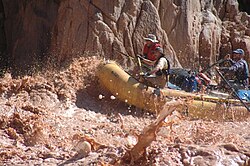Rafters in the Grand Canyon pass one of the rapids of the Colorado River