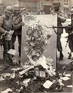 Chilean soldiers burning books and paraphernalia considered communist after the coup d'état (1973)