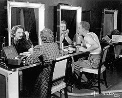 Albert and Grace Bradt applying makeup for their first early experimental TV appearance in November 1936