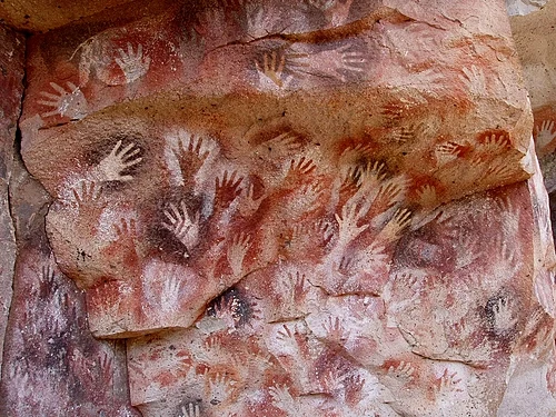 Cueva de las Manos, Perito Moreno, Argentina. The art in the cave is dated between 7,300 BC and 700 AD;[a] stenciled, mostly left hands are shown.[3][4]